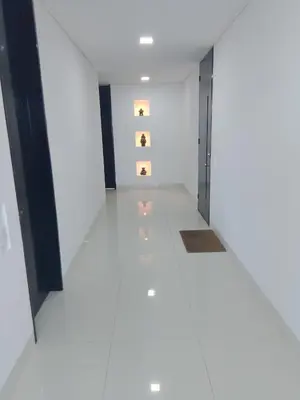 a room with white walls and a hallway with lights at Apartamento a 10 min del Aeropuerto x7Pax in Cartagena de Indias