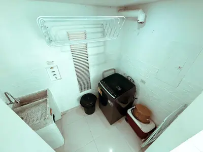 a bathroom with a toilet and a cross on the wall at Apartamento a 10 min del Aeropuerto x7Pax in Cartagena de Indias