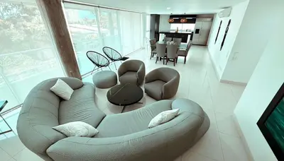 a living room with a couch and a dining room at Apartamento a 10 min del Aeropuerto x7Pax in Cartagena de Indias