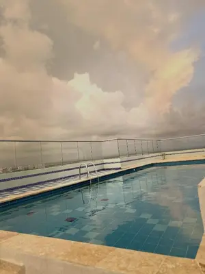 a swimming pool on top of a building at Apartment 5 minutes from the Airport, Sea and Center in Cartagena de Indias