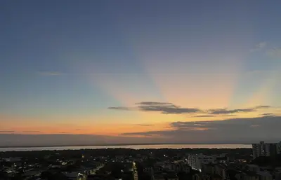 a view of a city with a sunset in the sky at Apartment 5 minutes from the Airport, Sea and Center in Cartagena de Indias