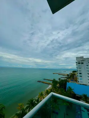 a view of the ocean from the balcony of a building at Apartamento de lujo frente al mar in Coveñas
