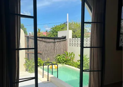 a view of a swimming pool from a window at Villa CANGGU- Villa con piscina privada, estilo mediterraneo in Tubará