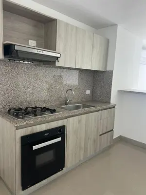a kitchen with a stove and a sink at ocean drive magnifica vista y piscina in Cartagena de Indias