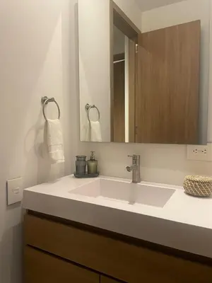 a bathroom with a white sink and a mirror at Apto de Ensueño en aguas cristalinas Baía Kristal in Cartagena de Indias