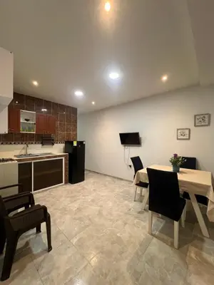 a kitchen and dining room with a table and chairs at Tu casa en cartagena in Cartagena de Indias