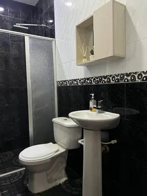 a bathroom with a toilet and a sink at Tu casa en cartagena in Cartagena de Indias