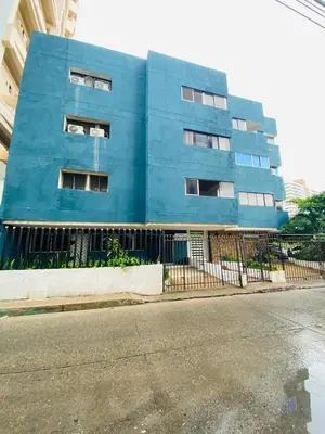 a blue building on the side of a street at Apartamento Los Lagos in Cartagena de Indias