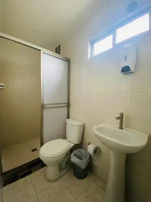 a bathroom with a toilet and a sink at Apartamento Los Lagos in Cartagena de Indias