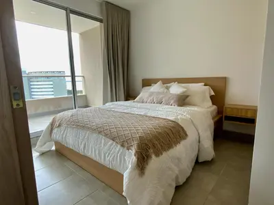 a bedroom with a bed and a large window at VISTA BAHIA Santa Marina Santa Marta in Santa Marta