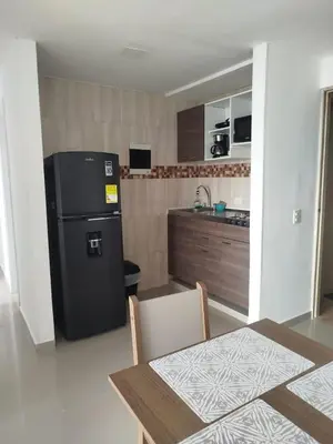 a kitchen with a refrigerator and a table with chairs at Cartagena Search in the Historic Center T6 in Cartagena de Indias