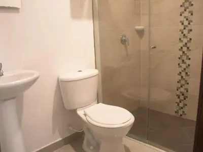 a bathroom with a toilet and a shower at Casa gimani Betts in Cartagena de Indias