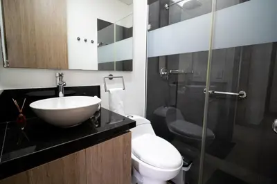 a bathroom with a sink and a toilet and a shower at Luxury-Ocean view apartment in Bocagrande in Cartagena de Indias