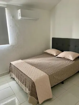 a bed in a white room with a bed sidx sidx sidx at Oceanfront accommodation! in Cartagena de Indias