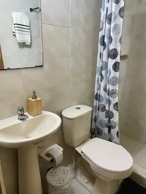 a bathroom with a toilet and a sink at Oceanfront accommodation! in Cartagena de Indias