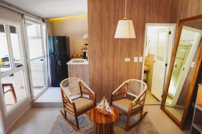 a living room with two chairs and a table at Suite Premium con Terraza y Jacuzzi Privado in Cartagena de Indias