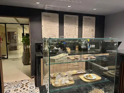 a display case in a bakery with some pastries at Arcadia Hotel in Cartagena de Indias