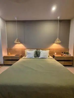 a bedroom with a large bed with two white pillows at Apartamento moderno con vista al mar y piscinas 1 habitación con balcón en Manzanillo,Cartagena in Cartagena de Indias