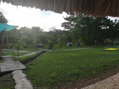 a view of a park with a grass field at Glamping Tesoro Escondido in San Antero