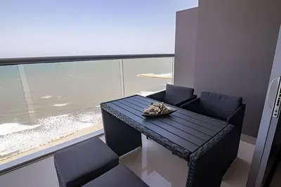 a cat sitting on a table in a room with a window at Lujoso Apto de 1 Habitación en Piso 14-Morros City in Cartagena de Indias