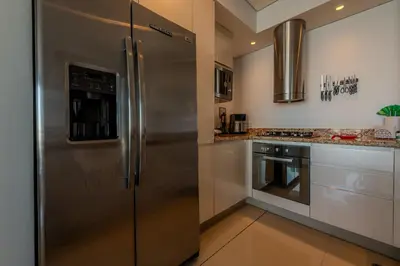 a large stainless steel refrigerator in a kitchen at Condominio H2-Luxurious 2 BR / 16th F - Bocagrande in Cartagena de Indias