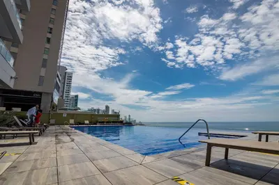 a swimming pool with a view of the ocean at Condominio H2-Luxurious 2 BR / 16th F - Bocagrande in Cartagena de Indias