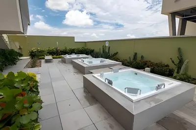 a pool with four sinks on a patio at Lujoso Apto de 1 Habitación en Piso 17 -H2 Hyatt in Cartagena de Indias