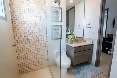 a bathroom with a toilet and a sink and a shower at Espectacular Vista desde Piso 17 -Morros City 1701 in Cartagena de Indias