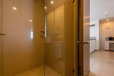 a glass shower in a bathroom with a sink at 1702 Morros City - Espectacular Apto en Bocagrande in Cartagena de Indias