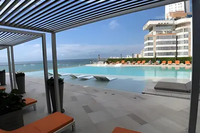 a swimming pool with a view of a building at 1702 Morros City - Espectacular Apto en Bocagrande in Cartagena de Indias