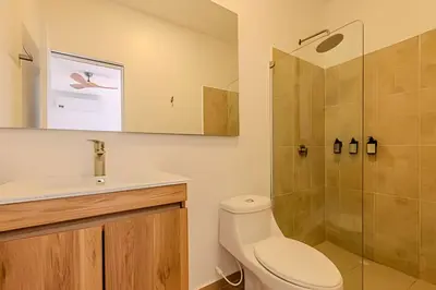 a bathroom with a toilet and a shower at Casa Encanto - Corazón de Getsemaní in Cartagena de Indias