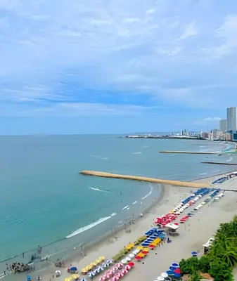 an aerial view of a beach with umbrellas and the ocean at 1705 Palmetto Beach -17th Floor Palmetto Beach in Cartagena de Indias