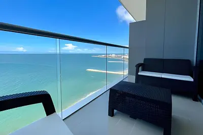 a balcony with a chair and a view of the ocean at Hermoso Apto 2 Hab Piso 19 en Morros City in Cartagena de Indias