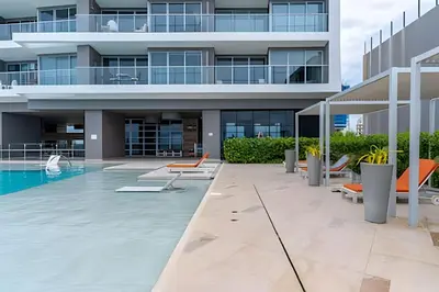 an image of a building with a swimming pool at Hermoso Apto 2 Hab Piso 19 en Morros City in Cartagena de Indias