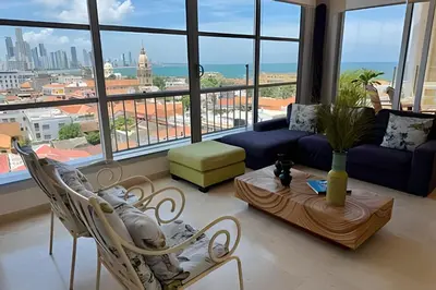 a living room with a view of a city at Espectacular apto de 2 hab en Centro Histórico in Cartagena de Indias
