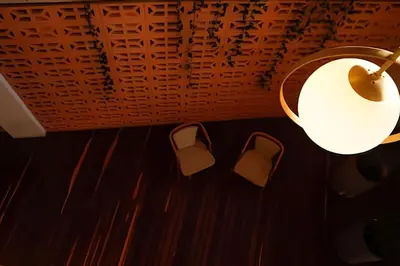 a lamp and some chairs in a room at Relaxing New Apt w/ Balcony in Getsemani! in Cartagena de Indias
