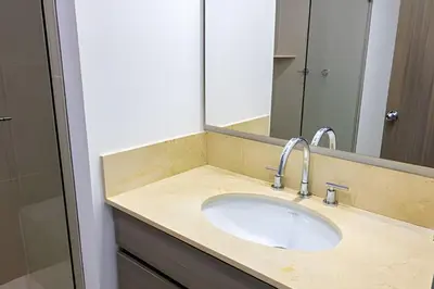 a bathroom with a sink and a mirror at Hermoso Apto Frente al Mar - Morros City piso 9 in Cartagena de Indias