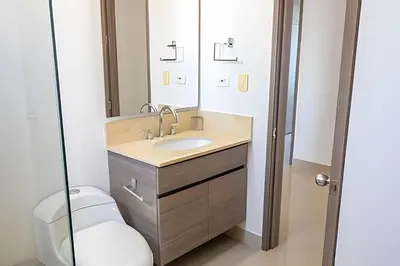 a bathroom with a sink and a mirror at Hermoso Apto Frente al Mar - Morros City piso 9 in Cartagena de Indias