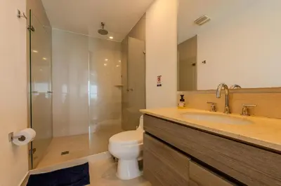 a bathroom with a toilet and a sink and a shower at 2102 Morros City - Espectacular Vista al Mar in Cartagena de Indias