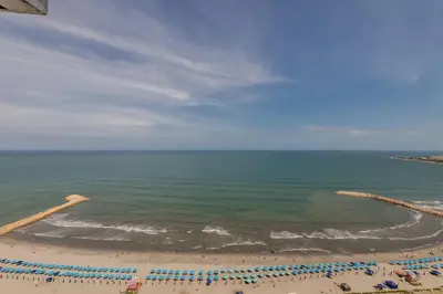 an aerial view of a beach with chairs and the ocean at 2102 Morros City - Espectacular Vista al Mar in Cartagena de Indias