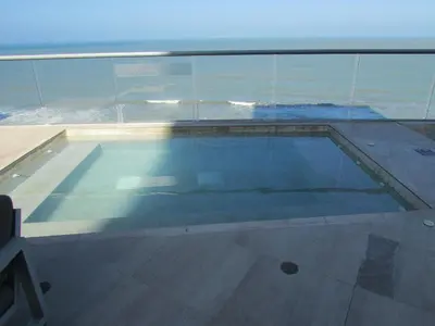 a swimming pool with a view of the ocean at Apartamento Aqua 805 - Morros City in Cartagena de Indias