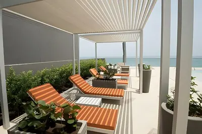 a balcony with chairs and a view of the beach at Apartamento Aqua 805 - Morros City in Cartagena de Indias