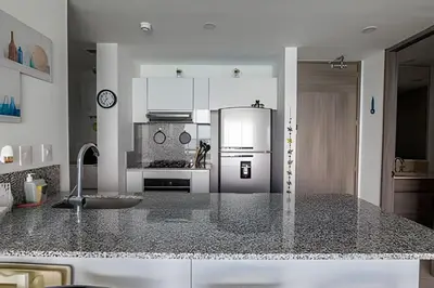 a kitchen with a refrigerator and a counter top at Morros City-Espectacular Apto Vista al Mar Piso 8 in Cartagena de Indias