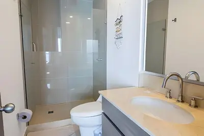 a bathroom with a sink and a toilet and a shower at Morros City-Espectacular Apto Vista al Mar Piso 8 in Cartagena de Indias