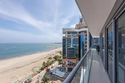 a balcony with a view of the beach and buildings at Hermoso Apto Frente al Mar - Morros City 801 in Cartagena de Indias