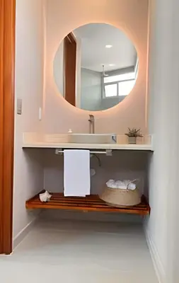 a bathroom with a sink and a mirror at Espectacular Vista Al Mar - Edificio Infinito 702 in Cartagena de Indias