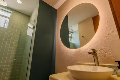 a bathroom with a sink and a mirror at Espectacular Vista Al Mar - Edificio Infinito 702 in Cartagena de Indias