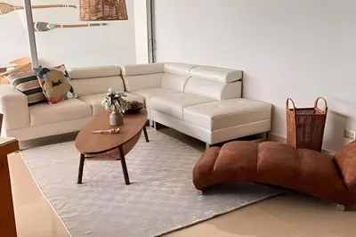 a living room with a white couch and a table at Espectacular Vista Al Mar - Edificio Infinito 702 in Cartagena de Indias