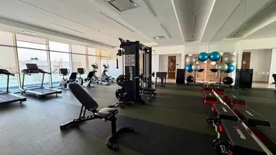 a gym with cardio equipment in a large room at H2 Lujoso Apto 1 Hab Piso 23 Compl. Empleada in Cartagena de Indias