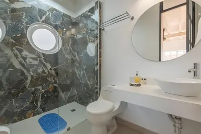 a bathroom with a sink and a mirror at El Mirador de la Catedral - Centro Histórico in Cartagena de Indias